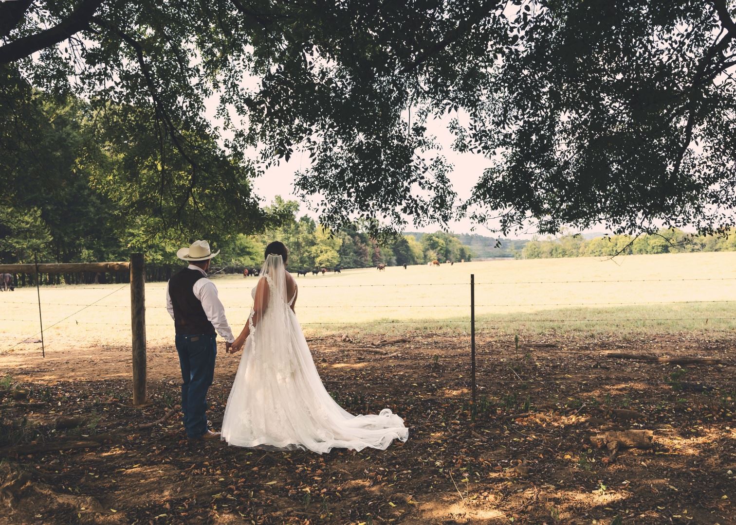 Ranch wedding country bride groom in jeans cowboy boots