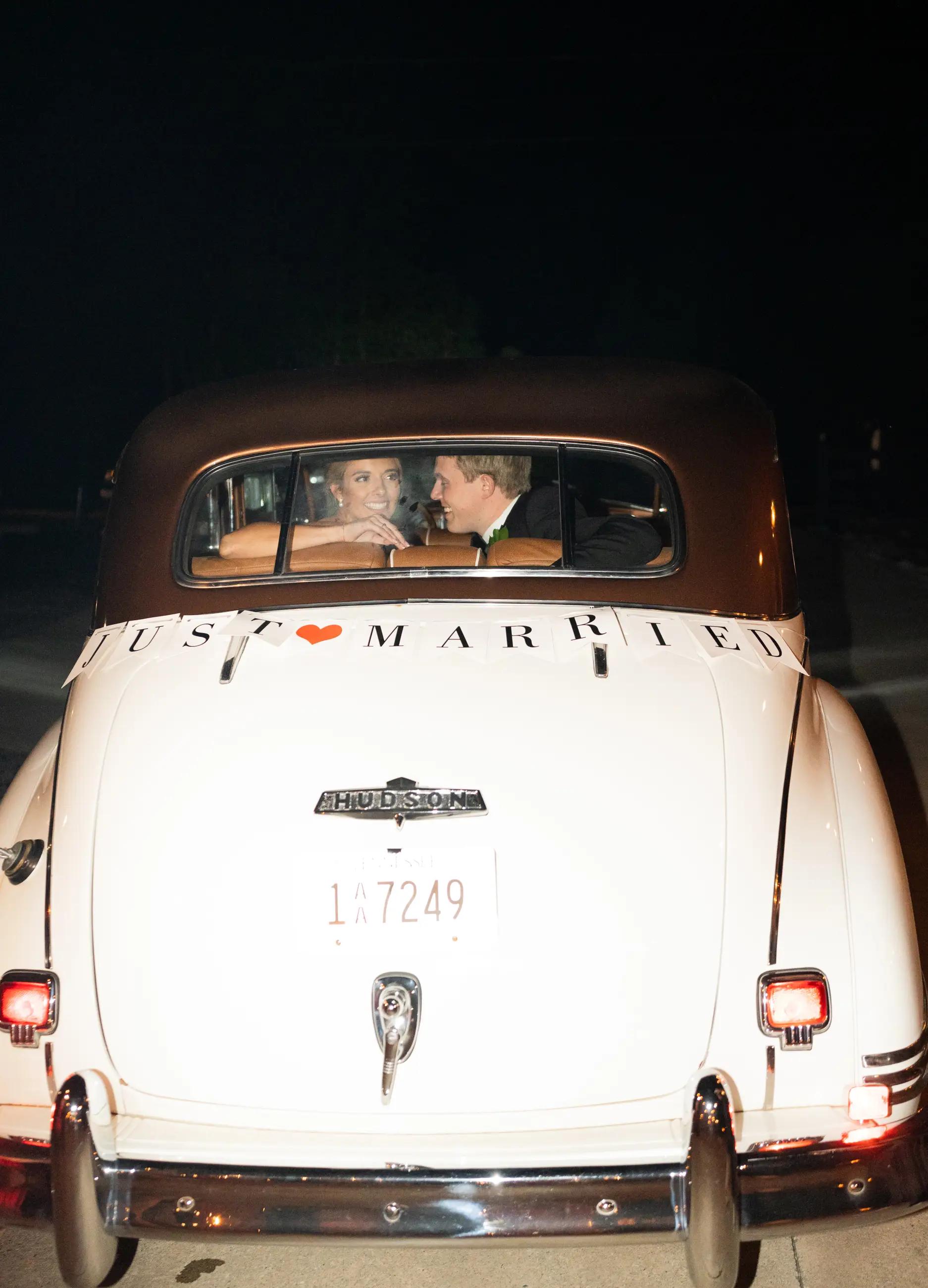 bride and groom in get away car