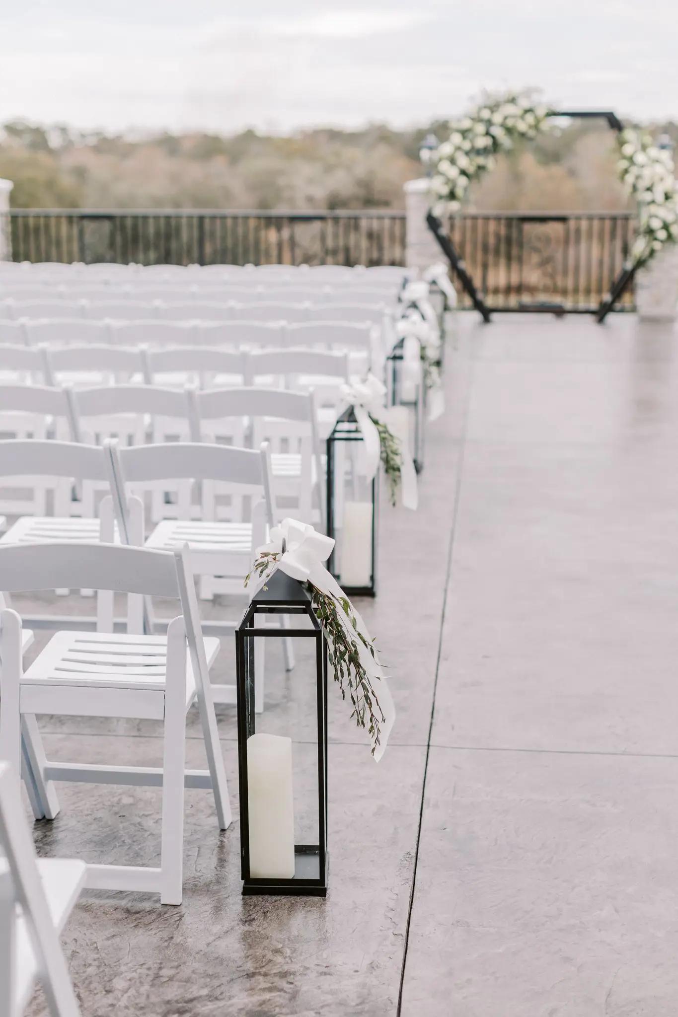 Wooden Chairs and wedding arch